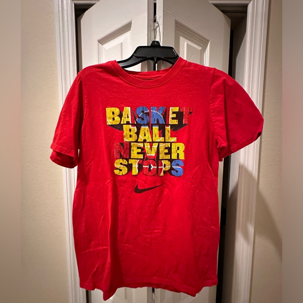 Nike- “Basketball Never Stops” athletic cut T Shirt